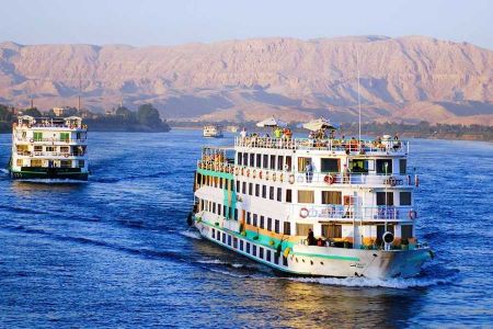 new year Nile cruise ship docked at Aswan with festive decorations for holiday celebration